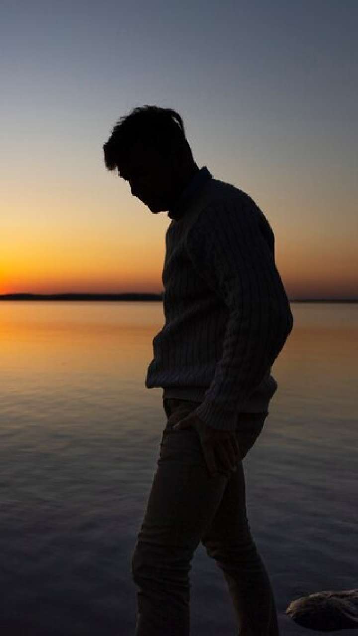 sad contemplative person near lake 23 2150420661 1721129373